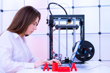 Young women designer in 3d printing lab