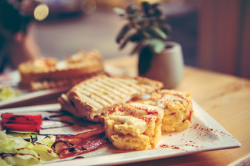 breakfast with scrambled eggs, toasts, juice and coffee