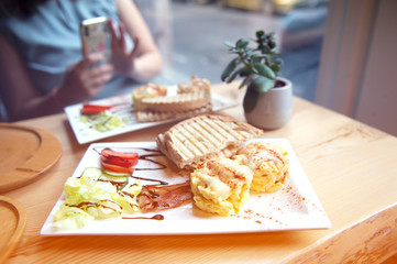 breakfast with scrambled eggs, toasts, juice and coffee