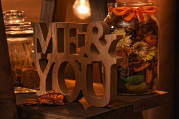 Beautiful vintage autumn composition with wooden me&you sign and dried flowers. Fall season. You and Me love forever concept.