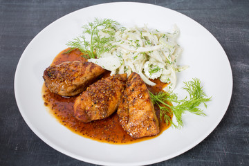 Grilled chicken fillets with cabbage salad.