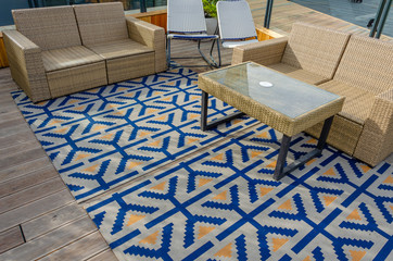 Sofa and table on the veranda of the summer cafe.