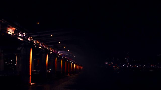 slow motion vdo relax and refresh with night travel activity from rainbow fountain water from the banpo bridge landmark of south korea