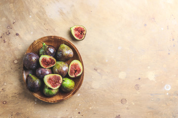 Figs on plate on beige table background