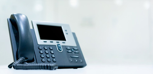 close up telephone landline on table at operation room in the office for business and technology...