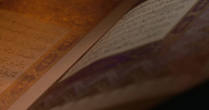 Holy Quran on Book Rest with Prayer Beads Close Up Rotation 9
