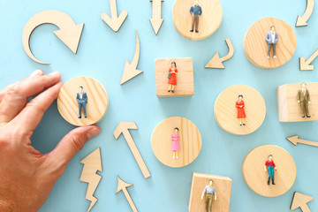 business concept image of people figures over wooden table, human resources and management concept