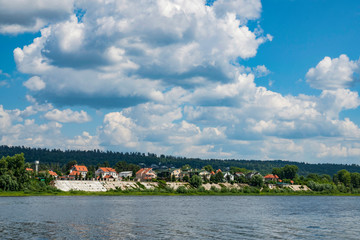 Fototapeta premium summer, clear, warm, day, trip, journey, walk, vacation, nature, forest, river, water, coast, village, houses, buildings, observations, trees, grass, blue, sky, clouds, space, distance