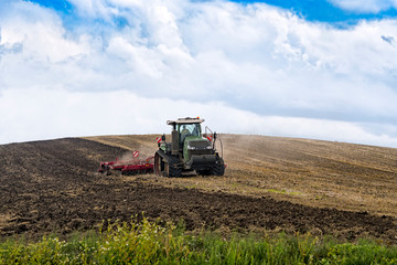 Fototapeta premium farmer in tractor