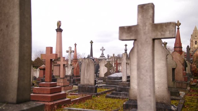 A Slow Motion Shot Of A Cemetery On A Overcast Day With Old Headstones