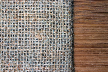 Canvas texture. Texture of an old napkin close-up. Napkin lying on a wooden table.