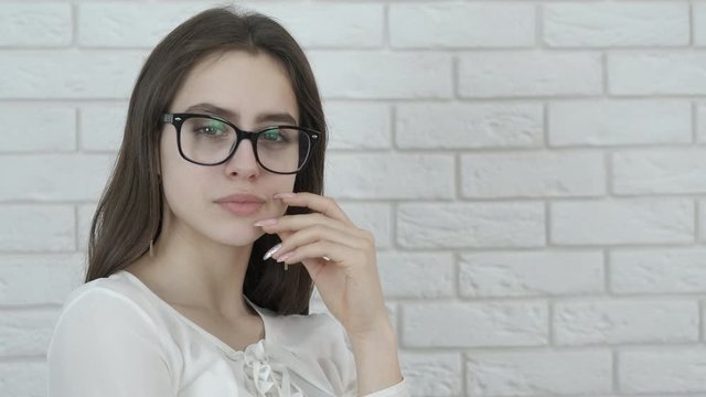 Portrait of a beautiful girl in glasses.