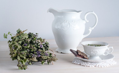 teapot and cup of tea on wooden background