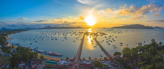 Naklejka premium aerial photography at Chalong pier. Chalong bay is the most important marina of Phuket there have 2 piers and customs at pier.. Chalong pier transport tourist to travel around islands in Andaman sea