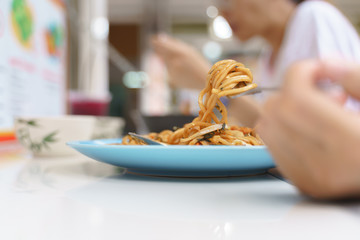 Eating Yakisoba or japanese fried noodles