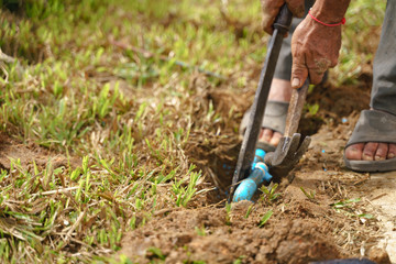 Plumber fixing broken water pipe