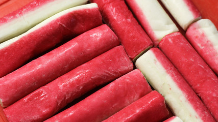 Crab sticks group top view for background