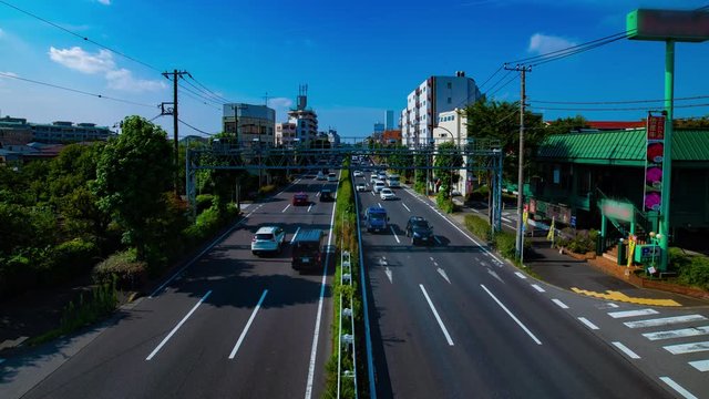 A timelapse of downtown street at Kanpachi avenue in Tokyo daytime wide shot panning