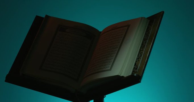 Light Passing over Holy Quran on Book Rest 5