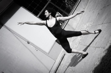 Dancer with black leotard and ballet tips