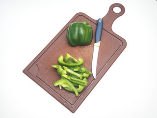 Green pepper fruit lies on the cutting Board.