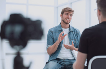 two young men talking in the TV Studio