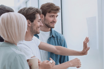 Fototapeta premium close up. creative team of colleagues standing in the office.