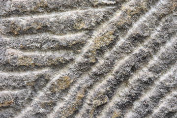 Fototapeta na wymiar Grey rough textured stone surface with scratches and yellow spots. Empty rocky space with grunge surface. Building material. Natural stone textured background