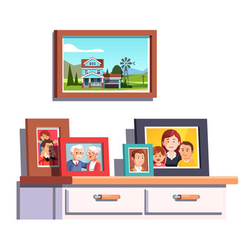 Family relatives photos frames on chest of drawers