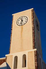 Fototapeta na wymiar Clock tower at Oia city in the Santorini Island