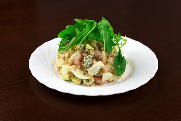  shrimp salad with egg and vegetables in a plate