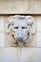 Valletta, Malta, August 2019. Bas-relief with the face of a lion on the old city wall.