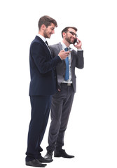 Fototapeta na wymiar full length . two businessmen using their smartphones