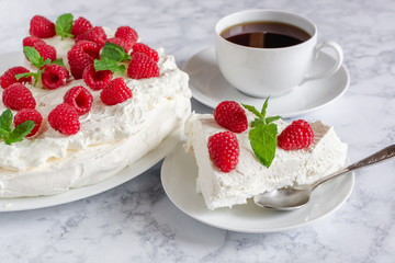 Meringue with whipped cream, raspberries.and mint