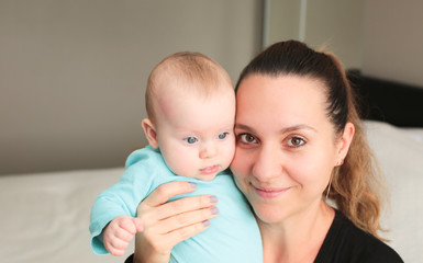 Close up portrait of Young Beautiful Mother with daughter, Cute 6 Month Old Baby Girl , Happy Family, Happy Mother’s Day, Best Mother Concept, The Most Beautiful Girls in the wo