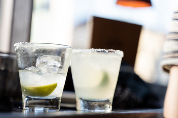 Close up of two margarita cocktail in glasses.
