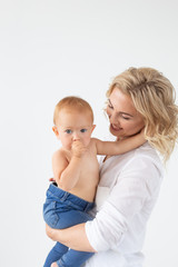 Childhood, motherhood and family concept - Portrait happy mother holds her baby