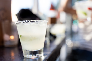 Selective focus of cocktail a margarita glass on a bar counter
