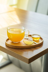 tea lemon, honey, sea buckthorn (warming hot tea, healthy food) menu concept. food background. copy space. Top view