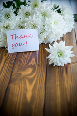 bouquet of white chrysanthemums on wooden table