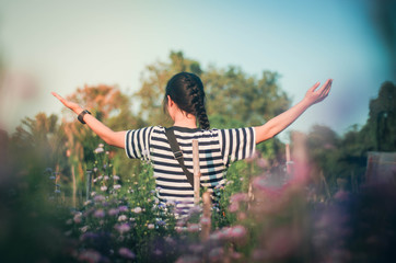 women raise their arms thank God along with praising God