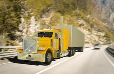 Fototapeta na wymiar Freight yellow truck on road