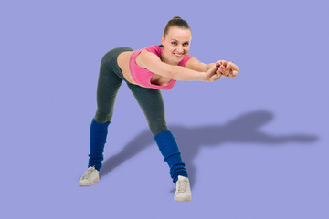 Young woman in sportswear having training and doing slope