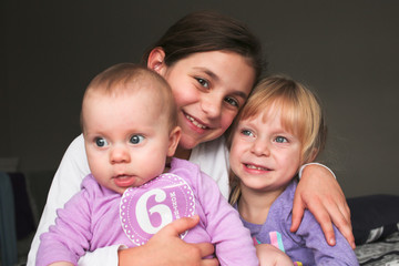 Close up Portrait of Three Beautiful Sisters, One Cute Toddler Girl , 6 Month Old Baby Girl, 7 Years Old Girl, Best Friends Forever, Happy  family concept, The most Beautiful Girls, Princesses 