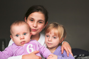Close up Portrait of Three Beautiful Sisters, One Cute Toddler Girl , 6 Month Old Baby Girl, 7 Years Old Girl, Best Friends Forever, Happy  family concept, The most Beautiful Girls, Princesses 