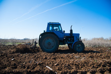 Fototapeta premium Agriculture with a tractor