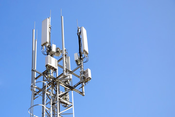 tower with mobile operator antennas  on the background sky