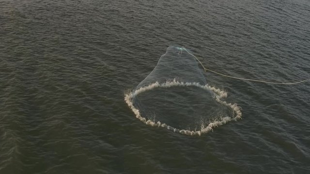 Slow motion Cast net for fishing catching fish in sea