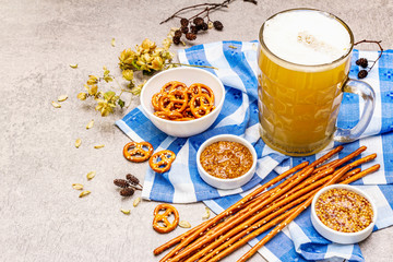 Oktoberfest set. Light beer, pretzels, mustard, sesame straw, hop.