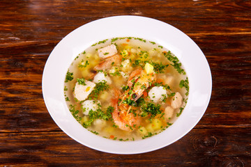 Fish soup with pieces of fish and shrimps